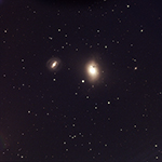 M85 with supernova (arrow)